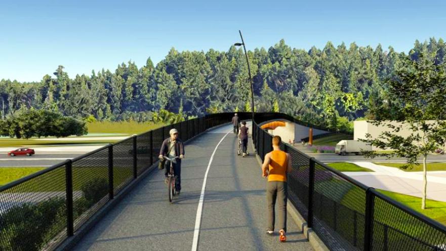 people walking and cycling on pedestrian bridge