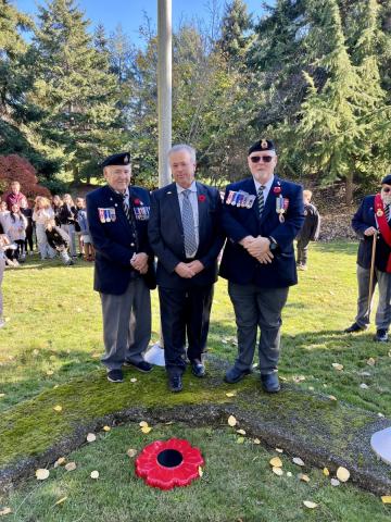 Three veterans and a city official standing at a Remembrance Day ceremony in Colwood.